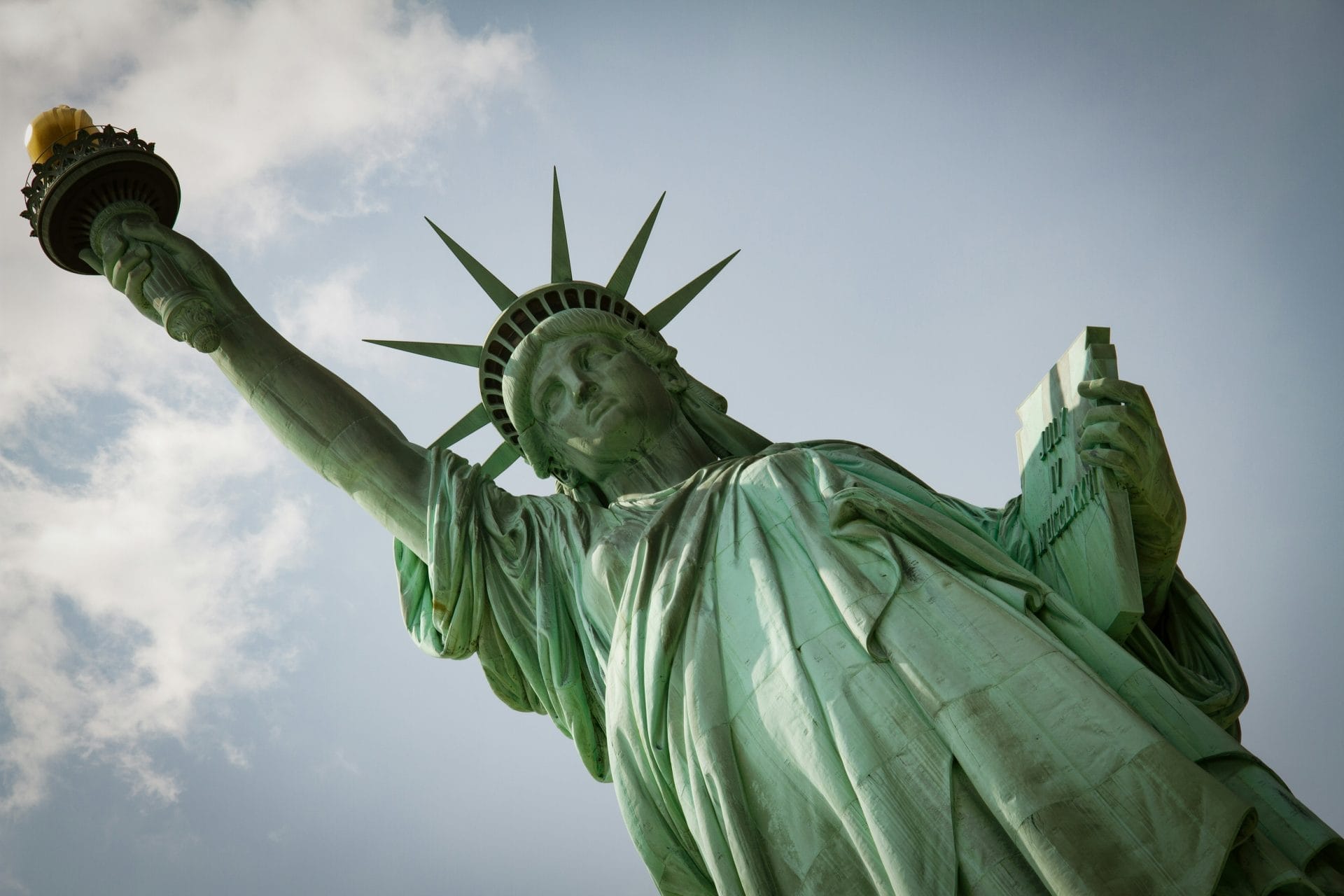 Best Time to Visit The Statue of Liberty, with her torch raised, is a must-visit landmark for travelers.